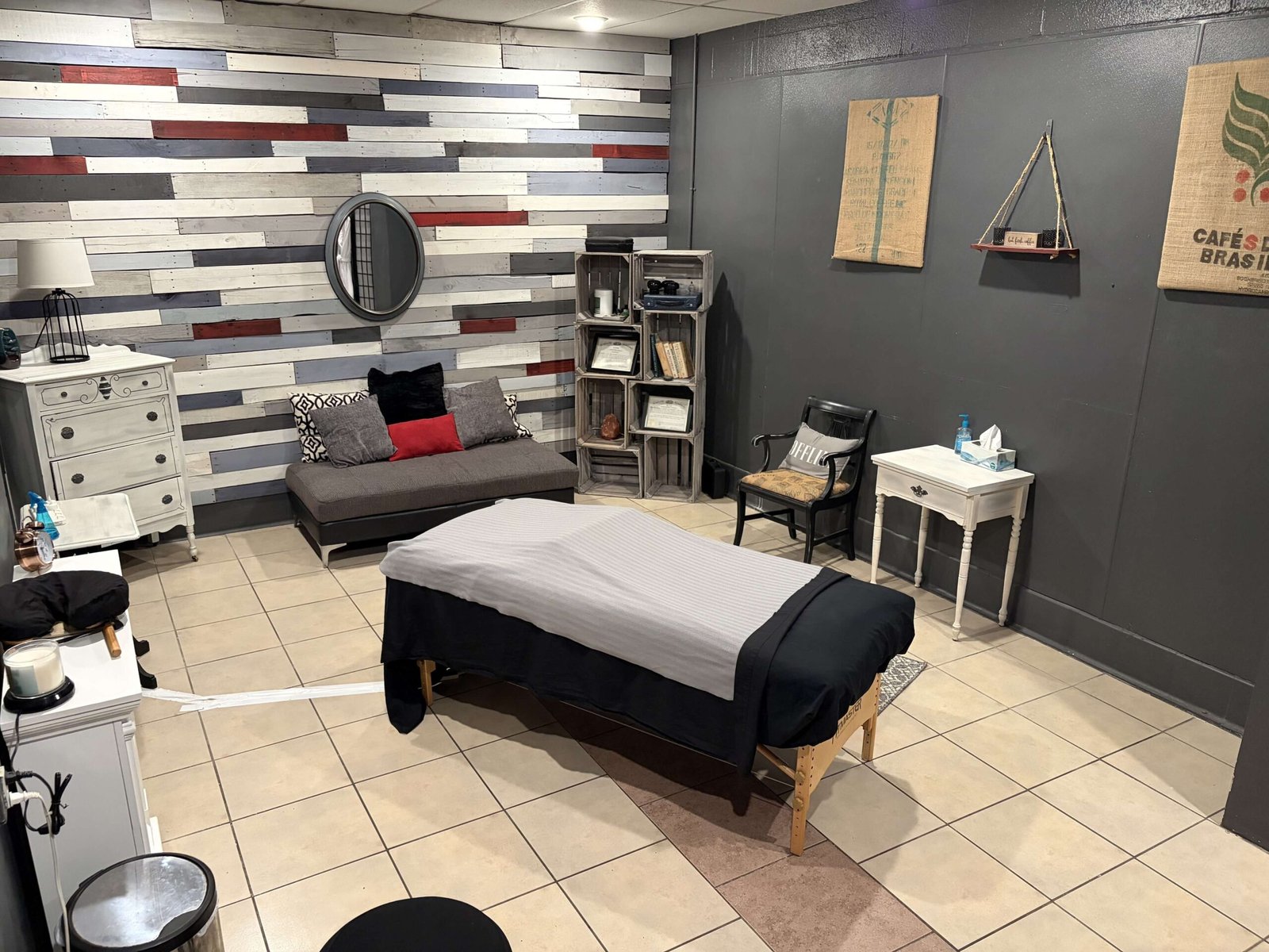 Massage treatment room with bed
